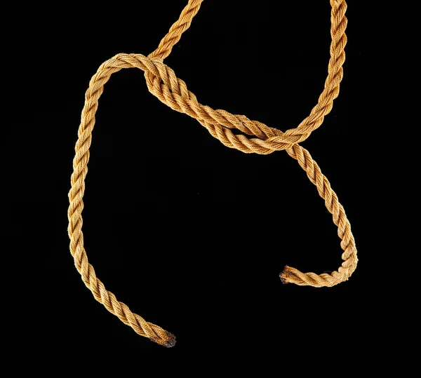 Rope knotted on black — Stock Photo, Image