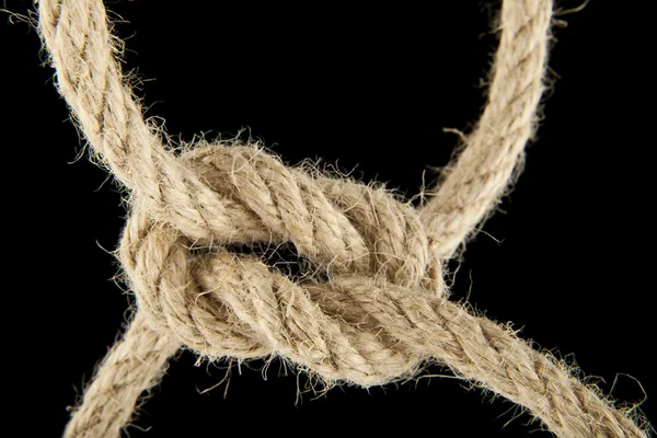 Rope knotted on black — Stock Photo, Image