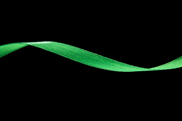 Green ribbon on black — Stock Photo, Image