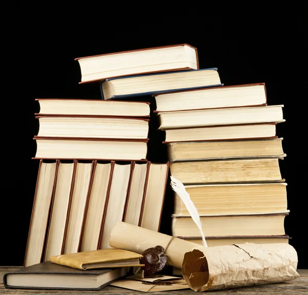 Old books an paper scrolls — Stock Photo, Image