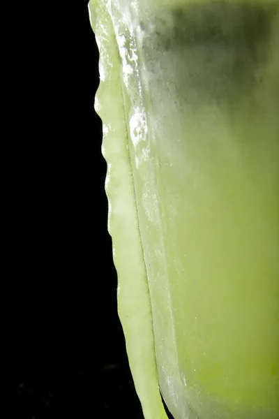 Frozen lime juice on black — Stock Photo, Image