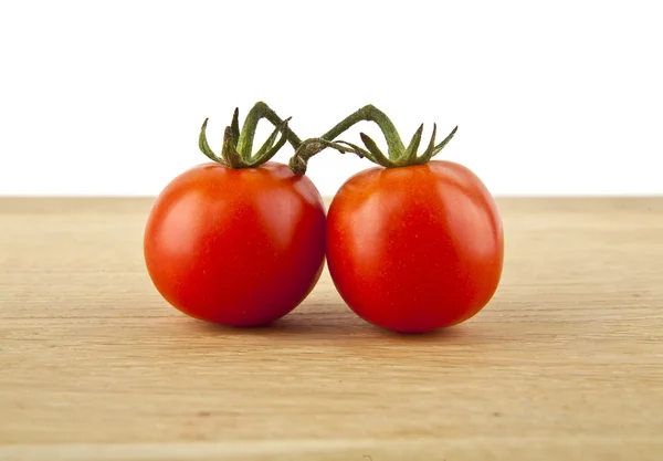 Fresh tomatoes on white — Stock Photo, Image