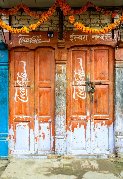 Vintage Coca-Cola sign on doors — Stock Photo, Image