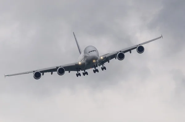 Passenger airliner in bad weather — Stock Photo, Image