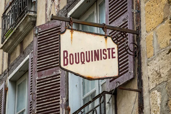 Weathered retro bookstore sign in France