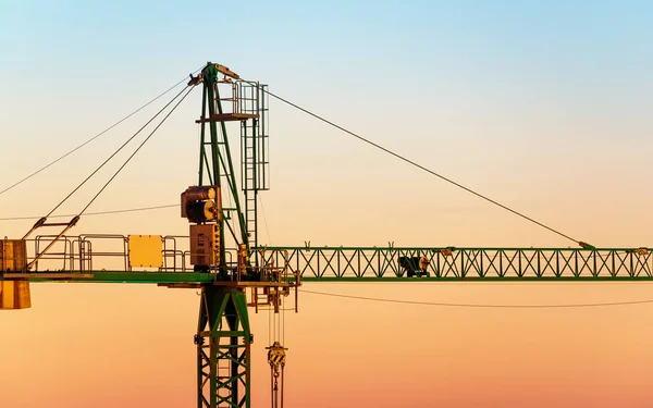 Tower crane at sunset — Stock Photo, Image