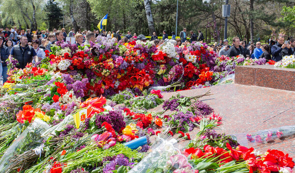 ODESSA, UKRAINE - MAY 9, 2021: Memorial of Unknown Sailor of Eternal Flame to defenders of Fatherland with flowers by fire. "Eternal Flame" in memorial to fallen defenders of Fatherland. Victory Day