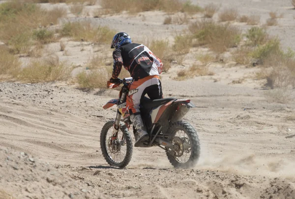 Off-road dirt bikes competing in a desert rally — Stock Photo, Image