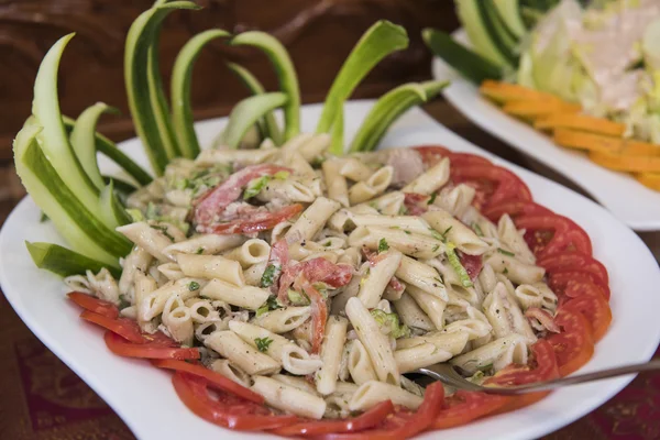 Pasta salad dish on a white plate — Stock Photo, Image