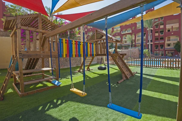 Childrens outdoor play area with swings — Stock Photo, Image