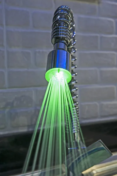 Ornate iluminated tap in kitchen — Stock Photo, Image