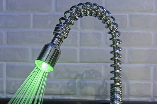 Ornate iluminated tap in kitchen — Stock Photo, Image