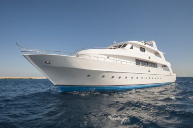 Luxury motor yacht at sea clipart