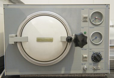 Autoclave sterilization machine in a clinic clipart