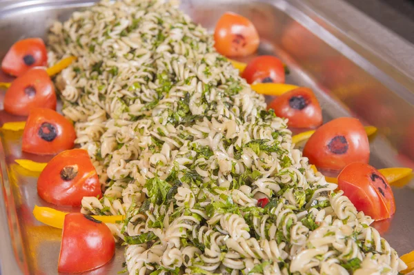 Pasta with herbs at a restaurant buffet — Stock Photo, Image