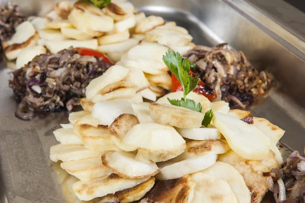 Roast potato slices at a restaurant buffet — Stock Photo, Image