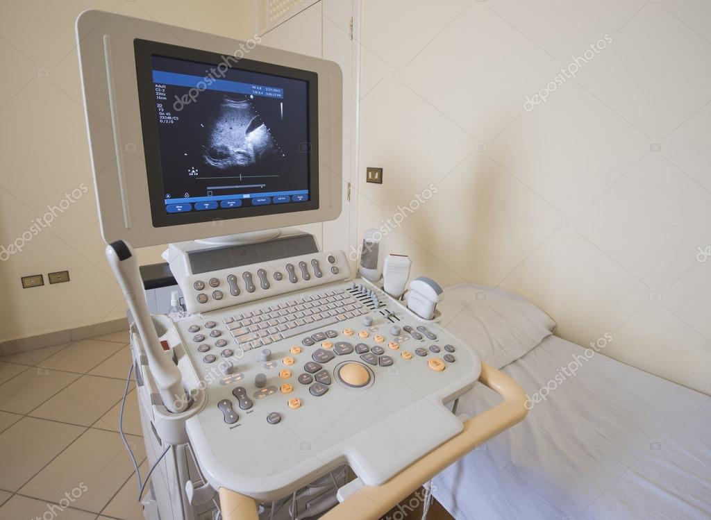 Examination bed and ultrasound scanner Stock Photo by ©paulvinten