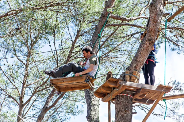 people training in a tree climbing park