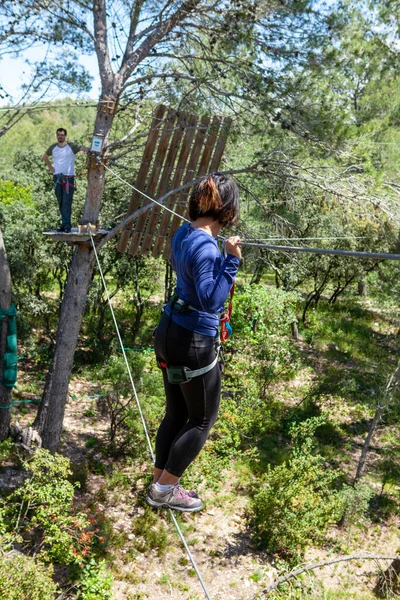 people training in a tree climbing park