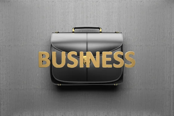 Briefcase on the background of gray concrete wall. Business conc — Stock Photo, Image