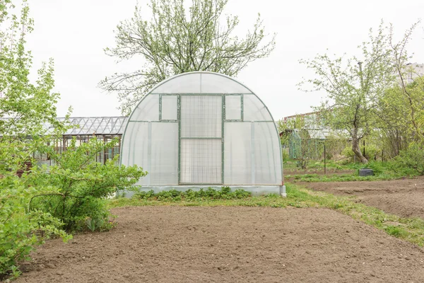 Greenhouse in garden — Stock Photo, Image