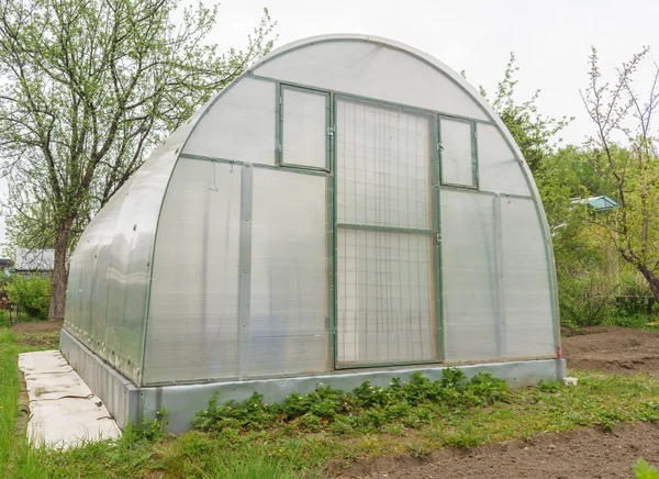 Greenhouse in garden — Stock Photo, Image