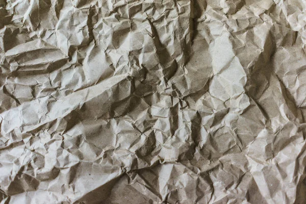 Papel de reciclaje de arrugas marrón fondo doblado textura de papel beige —  Fotos de Stock