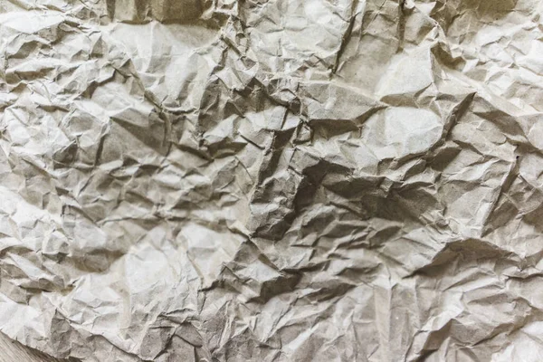 Papel de reciclaje de arrugas marrón fondo doblado textura de papel beige —  Fotos de Stock