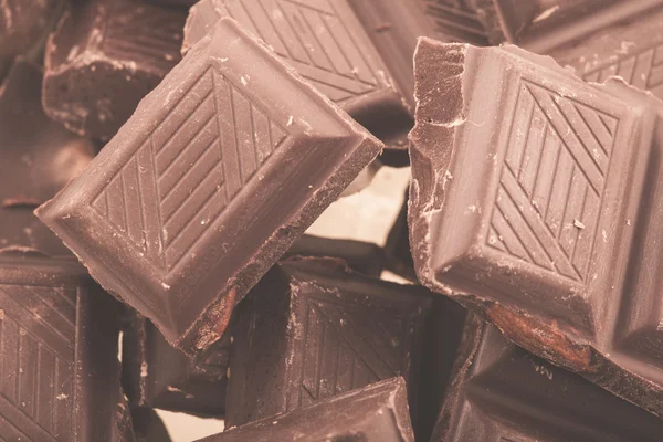 Pieces of milk chocolate — Stock Photo, Image