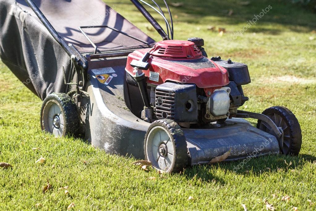 Modern gasoline lawn mower — Stock Photo © Supertrooper 84002896