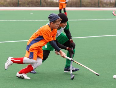 Youth field hockey competition clipart