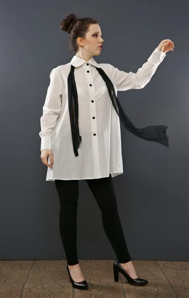 Teenager woman presents retro shirt, — Stock Photo, Image