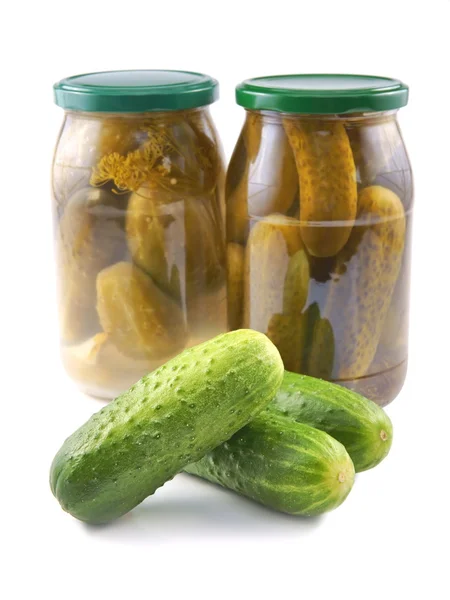 Cucumbers, Pickled and Canned in a jar, as well fresh loose — Stock Photo, Image