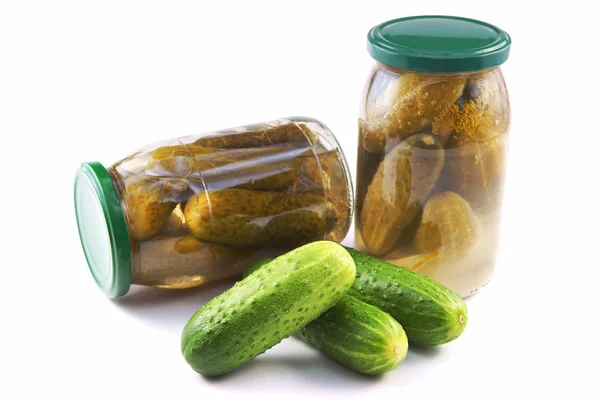 Cucumbers, Pickled and Canned in a jar, as well fresh loose — Stock Photo, Image