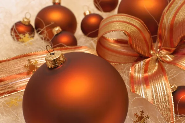 Christmas decorations, brown baubles, composition with bow — Stock Photo, Image
