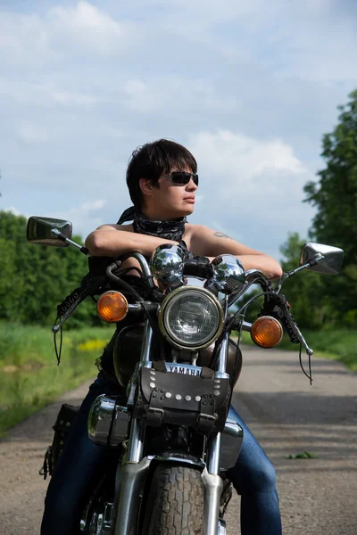 Stylish girl on a bike — Stock Photo, Image