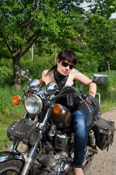 Stylish girl on a bike — Stock Photo, Image