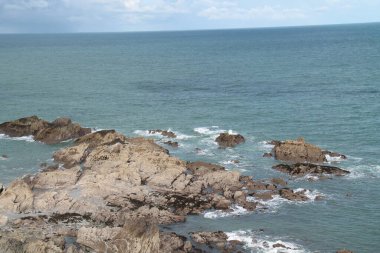 The Exposed Rocks of an Ocean Sea Coastline.