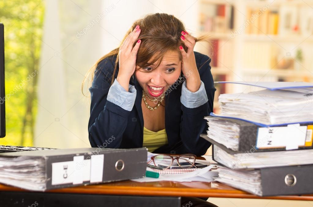 Business Woman Sitting By Desk Paper Files Spread Out Elbows On