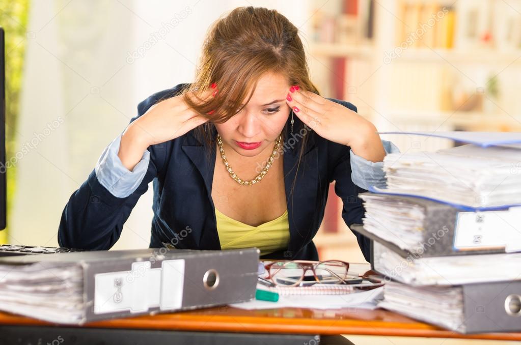 Business Woman Sitting By Desk Paper Files Spread Out Elbows On