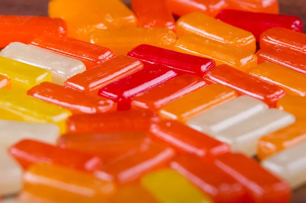 Closeup rectangular colorful shiny hard candy lined up — Stock Photo, Image