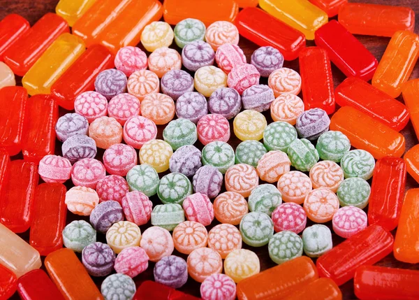 Closeup variation of colorful hard candy lying mixed as seen from above — Stock Photo, Image
