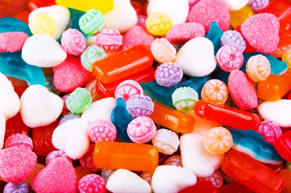 Closeup variation of colorful hard candy lying mixed as seen from above — Stock Photo, Image