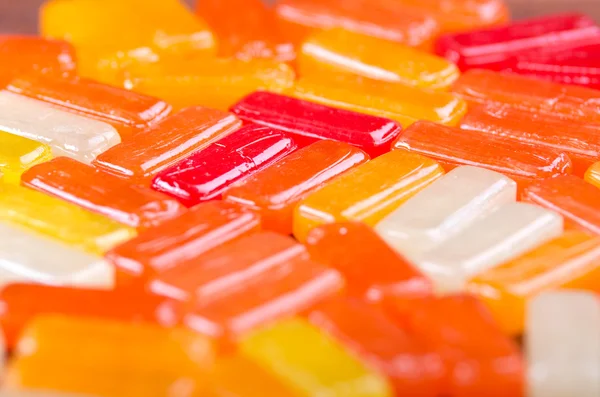Closeup rectangular colorful shiny hard candy lined up — Stock Photo, Image