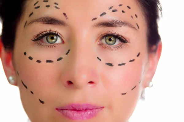 Closeup headshot caucasian woman with dotted lines drawn around face looking into camera, preparing cosmetic surgery — Stock Photo, Image