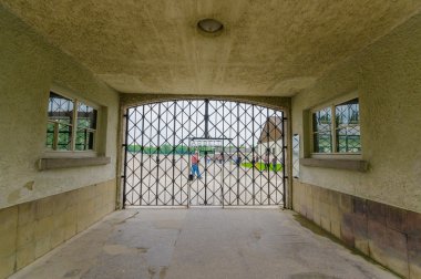 Dachau, Germany - July 30, 2015: Final gate entrance into concentration camp with famous words Arbeit Macht Frei, written in metal letters