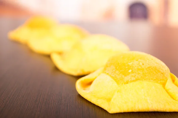 Traditional ecuadorian dessert, quesadilla with special form on wooden table — Stock Photo, Image