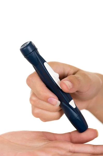 Doctors hand holding glucose measure scanning pen on patients finger with white background — Stock Photo, Image