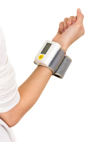 Right arm vertically wearing glucose meter around wrist with white background Stock Photo