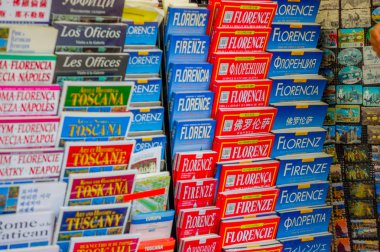 FLORENCE, ITALY - JUNE 12, 2015: Florence guide maps and turistic guides in all the lenguages